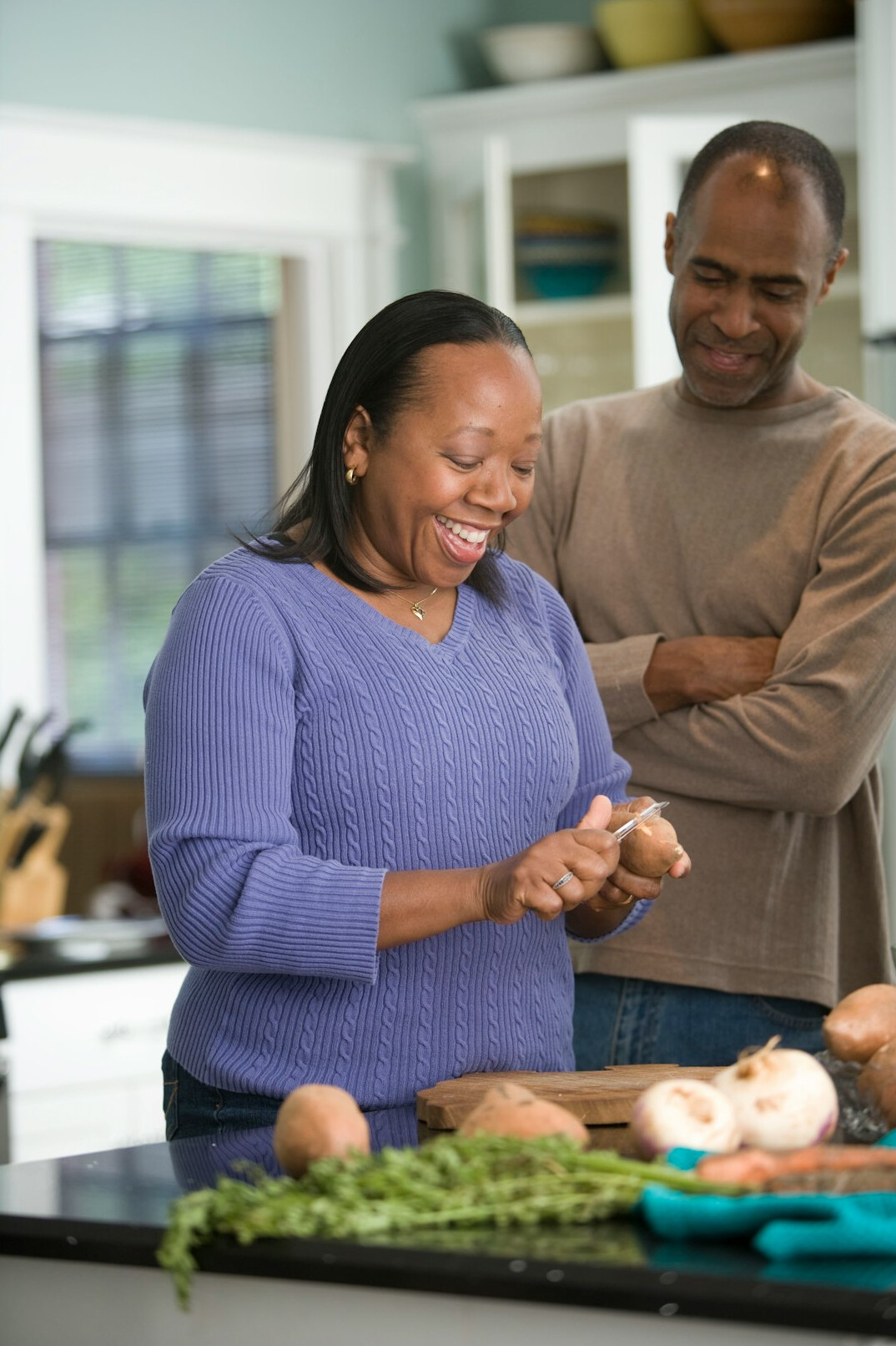 senior couple cooking healthy meal
