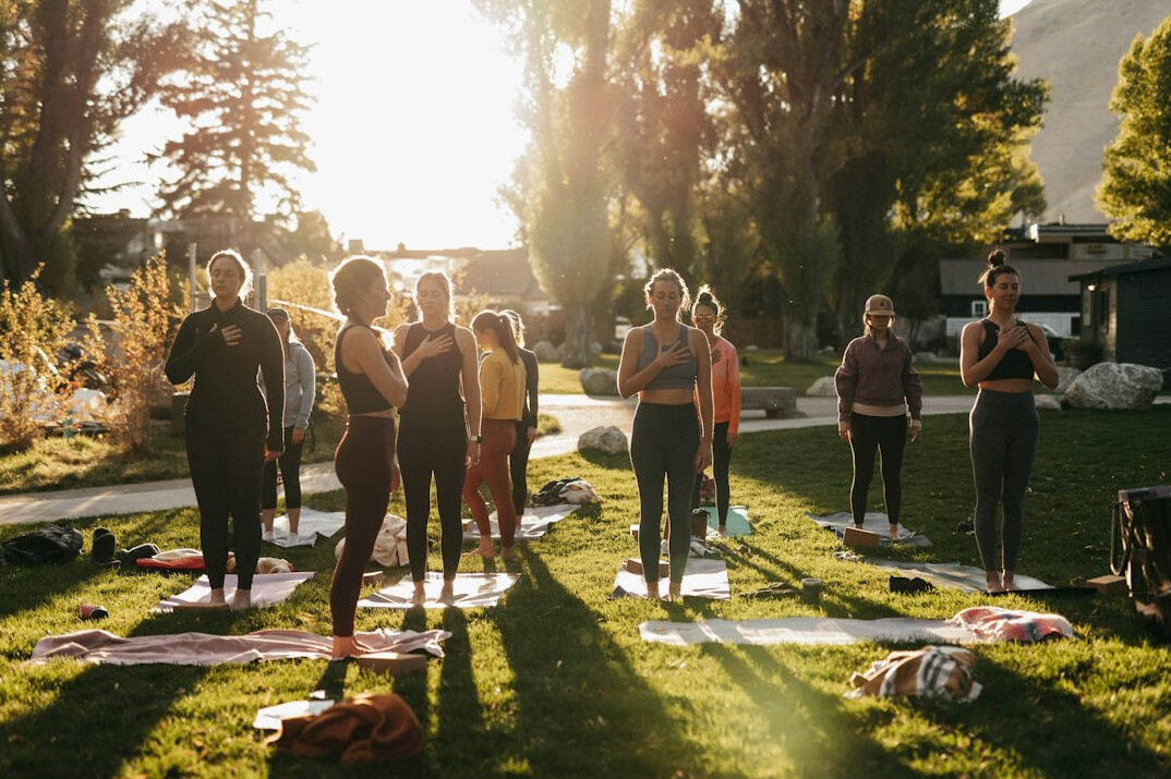 seniors doing yoga outdoors